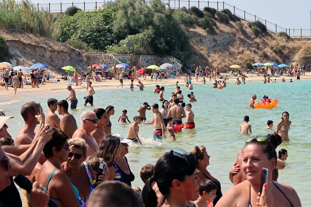 Crowds at a beach in Puglia for summer holidays